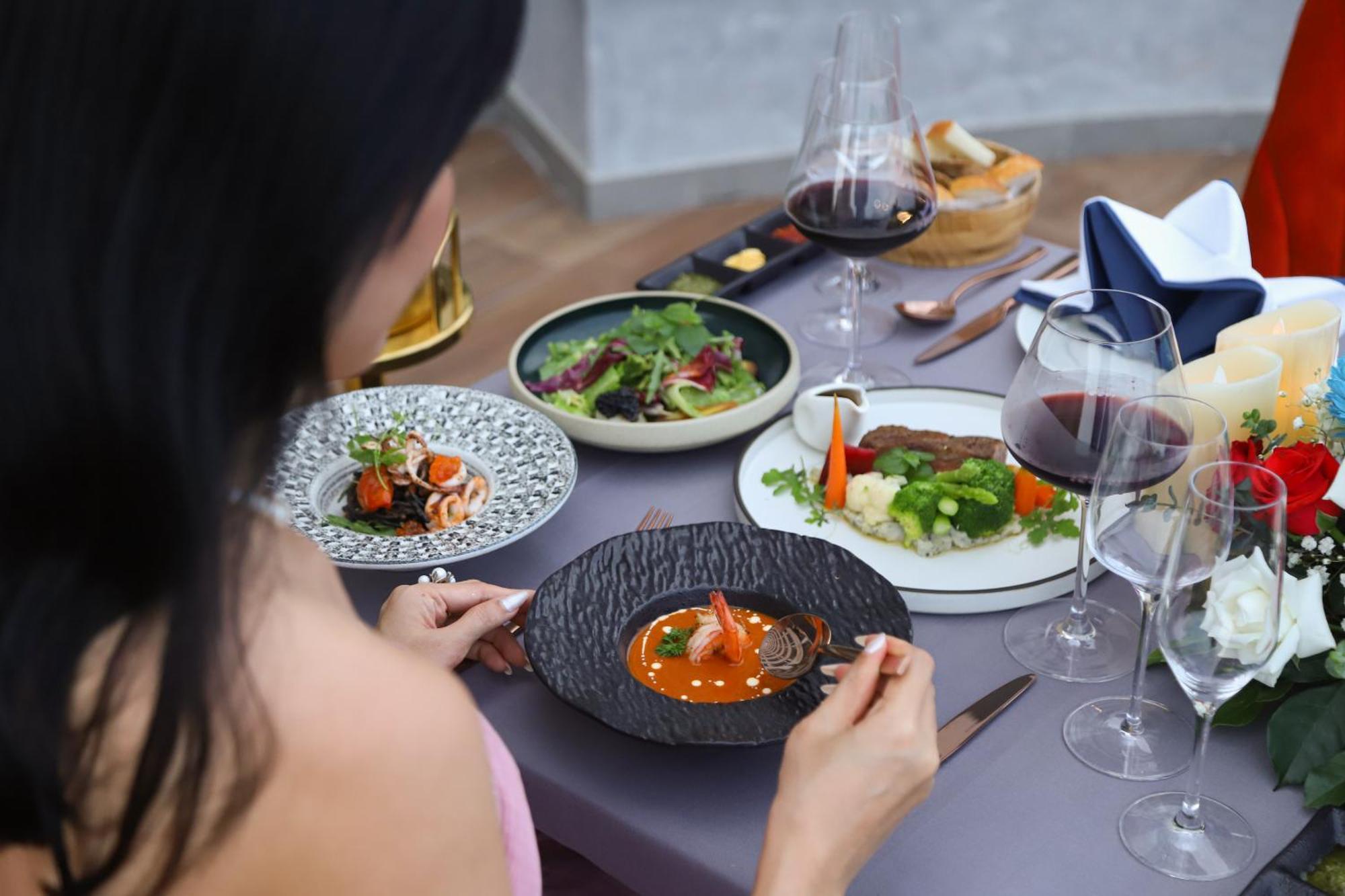 Vias Hotel Vung Tau - Transportation Included Экстерьер фото A woman eating a meal